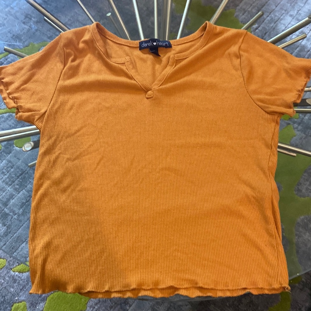 A woman’s small Derek heart shirt